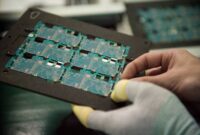 Chip giant infineon lowers * forecast electronics slowdown