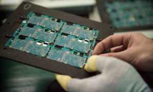 Chip giant infineon lowers * forecast electronics slowdown